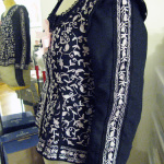 Crewelwork trim to tie sleeves visually in with jacket body